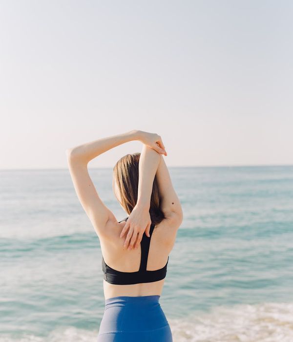 Person feeling energized and stretching towards the sun.